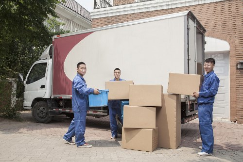 Student removals team helping with boxes and furniture in Ilford