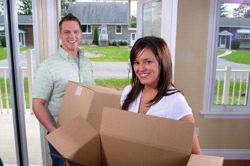 Careful wrapping and boxing of household items during an Ilford move