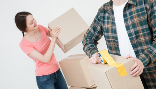 Local office removals planning in Ilford with moving team and business equipment