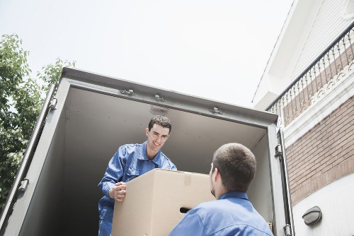Office furniture being moved carefully through a building during relocation